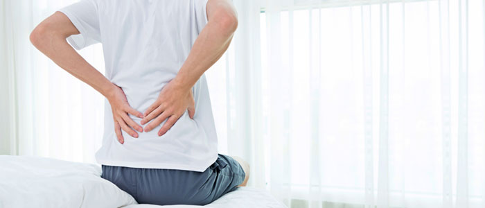man with back pain due to herniated disc